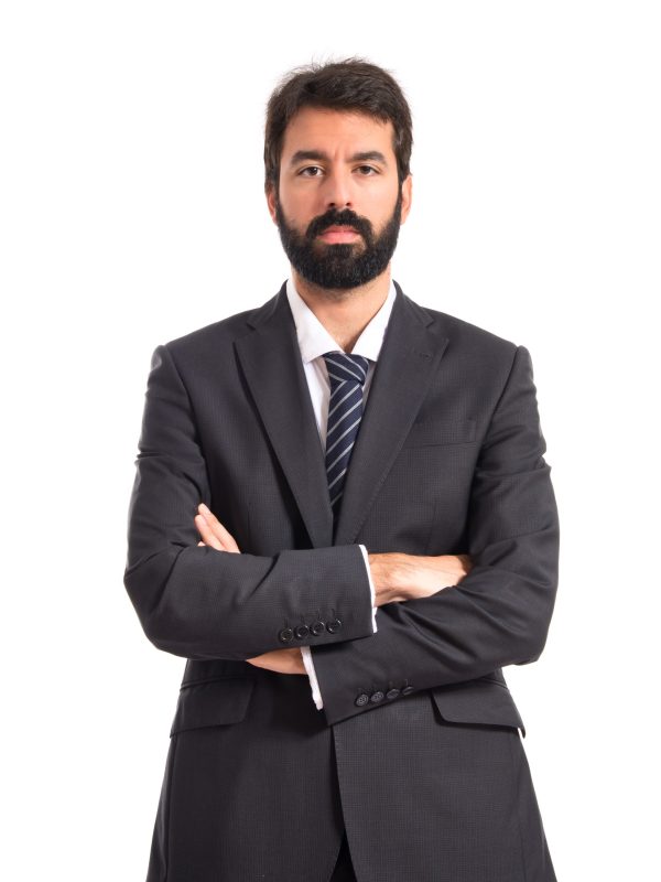 Businessman with his arms crossed over white background